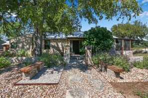 Living in harmony with nature, the Rock House is nestled into the trees