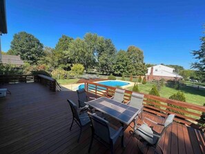 Bar top seating for six overlooking pool. Table for six overlooking pool and park tennis courts.