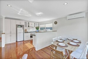 You’ll find the six-person dining table next to the large and well-equipped kitchen.