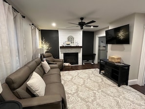 Living room with reclining chairs and gas fireplace