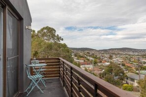 The front balcony captures sweeping views across the bay, city and Mount Wellington.
