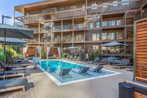 Community Pool w/ cabanas and lounge chairs