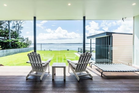 Take in stunning lakefront views from two Adirondack chairs on your private deck.