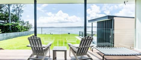 Take in stunning lakefront views from two Adirondack chairs on your private deck.