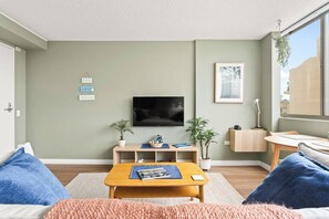 Get cosy in the living room, with a central TV catering to your evening entertainment.
