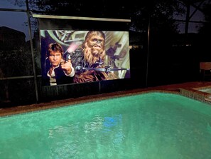 Enjoy The Poolside Theater At Night Watching Movies And TV