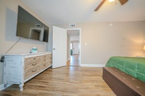 King bed room with large walk-in closet. Bench at foot of bed with storage. 58" TV. No cable or streaming provided. Must login to your accounts.