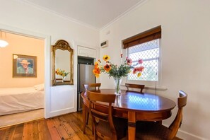 Dine together at the oval timber table.