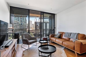 A generously sized sofa and cosy armchair in the living area offer an ideal spot to settle in with a movie, with split system air-conditioning ensuring year-round comfort.  
