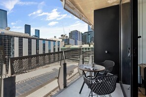 A private, full-length balcony includes a cosy two-seater to enjoy your morning cuppa or an afternoon glass of wine alfresco. 
