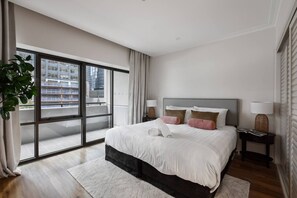The bedroom features a king-size bed and ensuite bathroom.