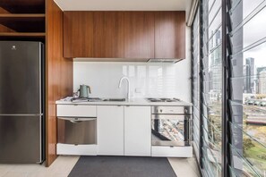 Whip up a meal at home with a well-equipped kitchenette offering a full-sized fridge, oven and dishwasher for easy cleanup.