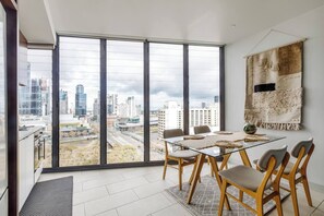  The stylish dining table in the kitchen overlooks the Yarra and Southbank for a fine home dining experience.