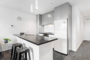 The kitchen is fully-equipped with everything you'll need. Grab a quick bite to eat at the breakfast bar, or set up your laptop and work from home.