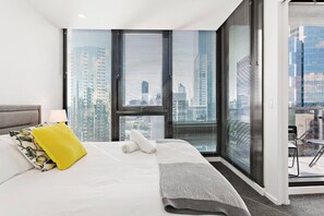 The second bedroom sleeps two in a queen bed where you can relax and enjoy wraparound views.