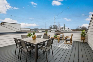 Large rooftop with lounge seating and dining for 6