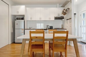 Staying in? Cook at home and dine together at the timber table.