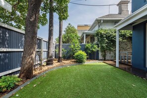 Head out to the fenced backyard for some playtime under the sun.