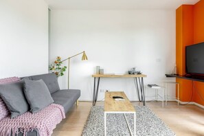 Kick back on the futon while watching TV.