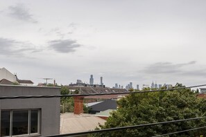 Enjoy glimpses of the CBD skyline from the living area and out on the balcony.