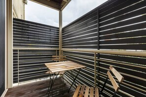 A comfortable and breezy—yet enclosed—balcony provides an outdoor space to enjoy a sundowner in complete privacy
