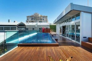  Make use of the luxurious rooftop deck that features a stunning outdoor pool and a fully-equipped gym.