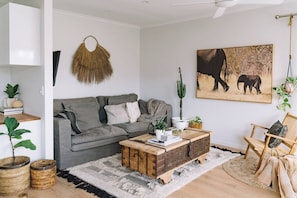 Kick back on the comfy sofa and enjoy a cosy movie night at home. The TV is tucked around the corner on the wall for your entertainment needs.