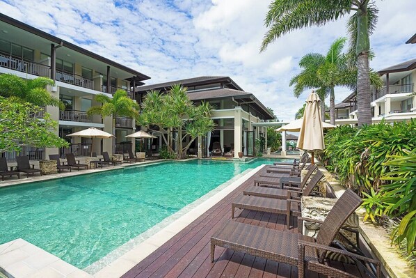 A beautiful lagoon-style swimming pool is perfect for soaking up the sunny climate. There's plenty of outdoor seating to relax.
