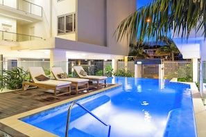Make a splash or swim laps in the infinity-edge swimming pool, shared within the apartment.