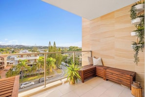 Take a moment out on the balcony, enjoying Queensland’s balmy weather.