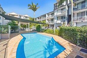 The main courtyard of the building has a lovely shaded pool free for you to take a dip in or just relax on the lounge chairs