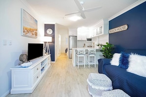 A welcoming, open-plan layout offers casual dining on the breakfast bar.