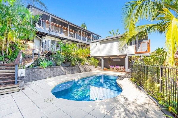 Take a dip in the sparkling swimming pool set among the beautiful tropical gardens.
