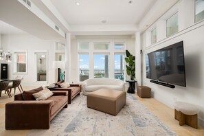 Lounge in the spacious living area while looking out to the Gulf!