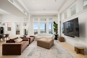 Lounge in the spacious living area while looking out to the Gulf!