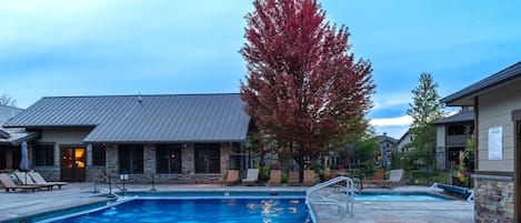 Community clubhouse with a heated pool and hot tub open year round