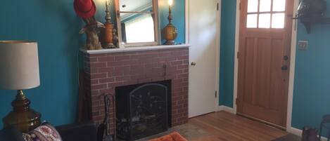 Front entry and living room with wood fireplace