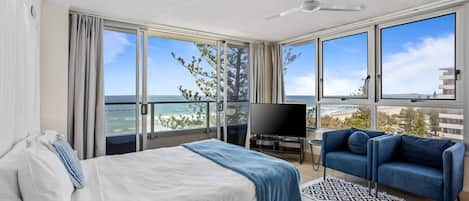 Wake up to breathtaking views across the ocean from your plush studio apartment with a charming balconet on the beachfront at Surfers Paradise.