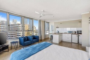 The premium queen-sized bed is topped with luxury hotel style linens for a good night's sleep. There is wardrobe space for your belongings.