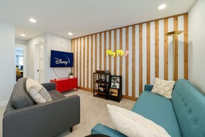 Relax in this retro-inspired lounge with smart TV and vinyl station.