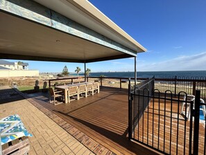 Rear Decking & Dining Area with Beach Frontage