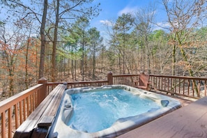 Take in the forest views and unwind in the private outdoor hot tub.