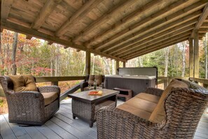 Over-sized back porch with seating that over-looks the creek 