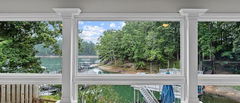 Lounge in the serene sunroom & take in the gorgeous views of Lake Lanier