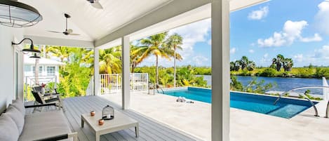 Veranda lounge overlooking the villa's private freshwater pool. 