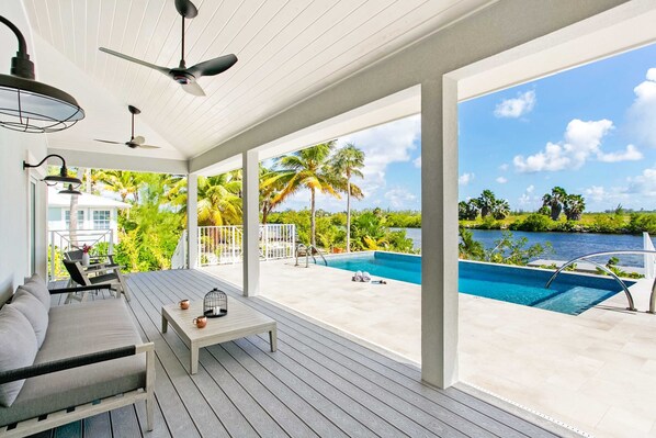 Veranda lounge overlooking the villa's private freshwater pool. 