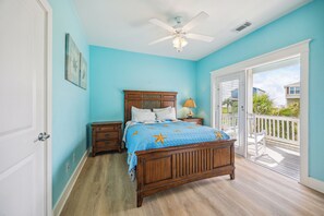Bedroom 2 with a view of the neighborhood and the lake.
