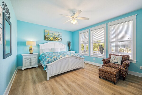 Master bedroom with a private balcony.