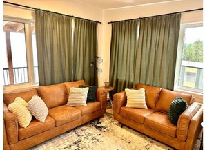 Living room with plush furniture and pillows