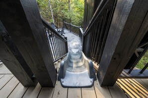Slide between middle deck to lower deck